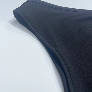 Detail shot of black high-elastic knit fabric with professional double-needle stitching