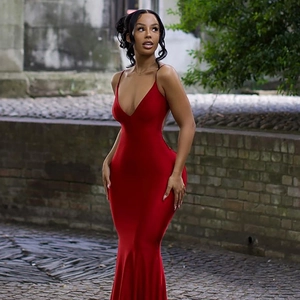 Elegant red backless fishtail dress with deep V-neck and spaghetti straps on street