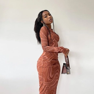 Detail of slim fit long sleeve midi dress featuring brown marble print fabric