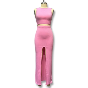 Detail of pink ribbed knit fabric texture on cropped top and side slit maxi skirt set