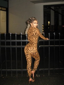 Close-up of leopard print bodysuit with high neck and long sleeves in tight fit