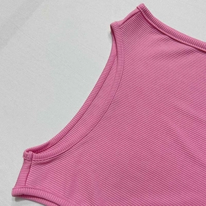 Detail of pink ribbed knit fabric with seamless binding edges for women's tank top