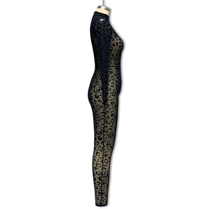 Detailed view of leopard print flocking on sheer mesh fabric of a slim bodysuit