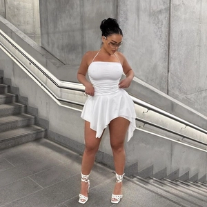 Detail view of the ruched chest design and halter neckline on this white mini dress