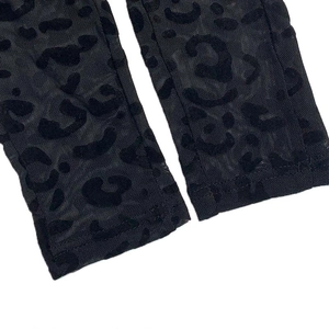 Close-up of black leopard print mesh sleeve with premium flocking and sewing detail