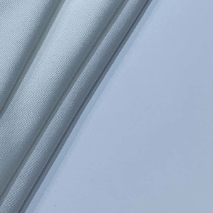 Close-up detail of white woven fabric with fine synthetic fiber grid texture and soft finish