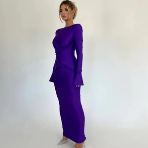 Detail of purple slim fit evening dress with ruched waist and flared bell sleeves