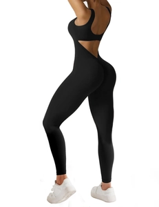 Macro shot of the crisscross back straps and open back design on the black yoga jumpsuit