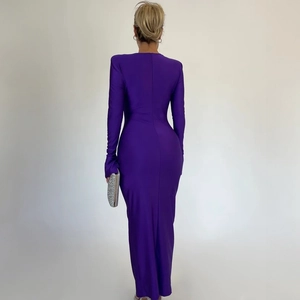 Back view of a purple slim fit floor-length dress with shoulder pads and flared sleeves