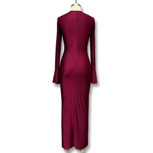 Detail of the hidden back zipper on a wine red bodycon maxi dress with flared sleeves
