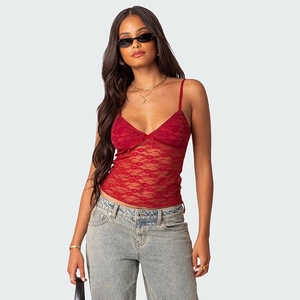 Close-up of red lace camisole with deep V-neck and delicate bow detailing