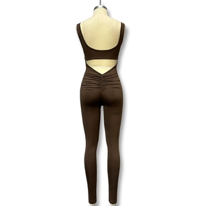 Detail of deep brown sleeveless ruched jumpsuit featuring a chic back cut-out design