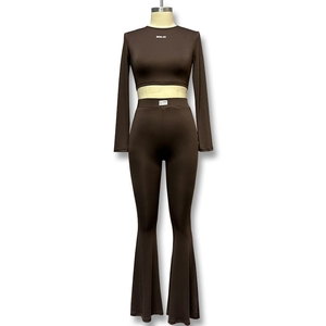 Women's two-piece lounge set with deep brown long sleeve crop top and flared pants