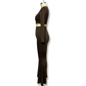 Detail view of dark brown long sleeve crop top and high waist flared trousers set