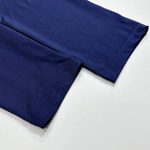 Detailed close-up of double-needle reinforced stitching on navy blue elastic fabric