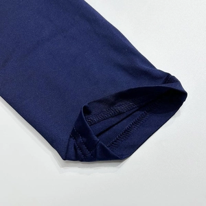 Close-up of navy sleeveless bodysuit showing premium knit texture and durable stitching