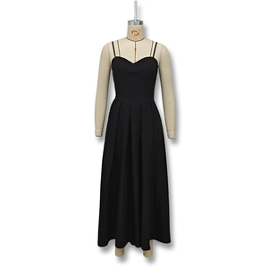 Detailed view of the elegant black V-neck maxi dress with thin straps and pleated hemline