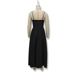 Detail of the open back design and adjustable waist pleats on this black maxi dress