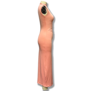 Detail of coral orange sleeveless dress showing side ruching and waist pleats