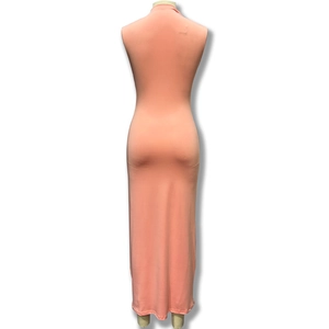 Detail view of the sleek bodycon back and peach fabric texture of this sleeveless maxi dress