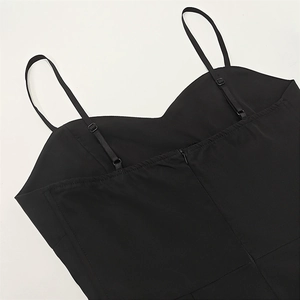 Detailed view of black V-neck summer dress featuring thin straps and back zipper closure
