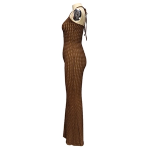 Macro detail of brown halter knit jumpsuit featuring honeycomb textured fabric and open back