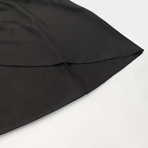 Close-up of the smooth hem and precise stitching on the black French V-neck maxi dress