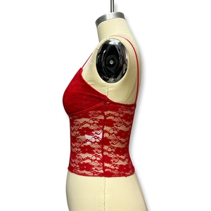 Close-up of the red floral lace texture and stitching on this slim-fit V-neck camisole top