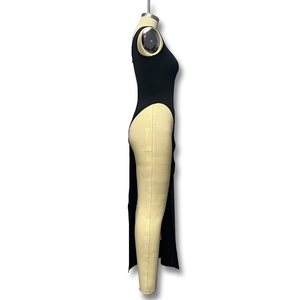 Detail view of black sleeveless slim fit dress featuring a high side slit design
