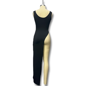 Detail of slim fit black sleeveless dress featuring a high side slit on a white background