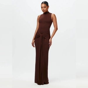 Detail of cross-knot and draped pleats on this dark brown bodycon sleeveless dress