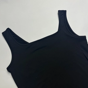 Detailed view of black slim fit U-neck sleeveless top with elastic ribbed fabric