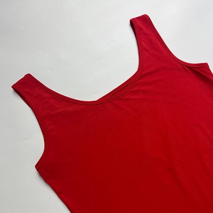 Detailed flat lay of red U-neck tank top showing stitching and high-stretch fabric texture