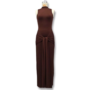 Detailed view of the elegant chocolate brown sleeveless dress with waist pleats and knot detail