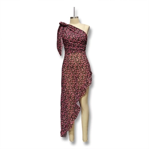 Detail of floral one-shoulder dress with ruffled hem and side pleats in black