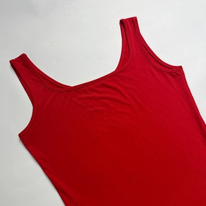 Close-up of bright red scoop neck tank top featuring high-elastic fabric and fine stitching