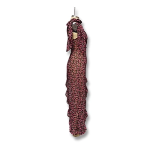 Detail view of the cascading ruffles and floral print on a summer maxi dress
