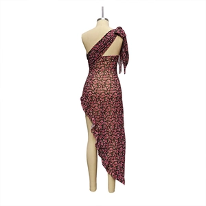 Detail of the asymmetric one-shoulder floral dress with a decorative bow on the back