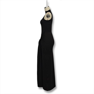 Detail of side ruching on elegant black sleeveless high neck bodycon maxi dress