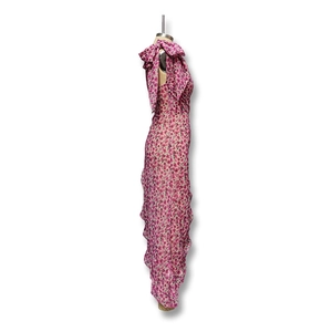 Detail of floral chiffon summer dress showing side ruching and shoulder bow decoration