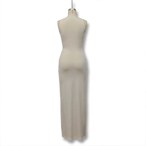 Detail view of cream sleeveless bodycon maxi dress with back seam and tailored fit