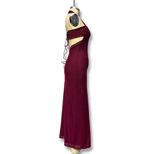 Detailed side view of wine red halter dress showing waist cutout and back lace-up straps