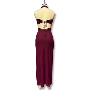Detail of deep red halter maxi dress featuring open back design and delicate straps