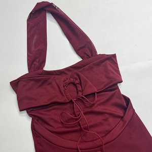 Detail of burgundy halter dress with mesh neckline and drawstring hollow-out design