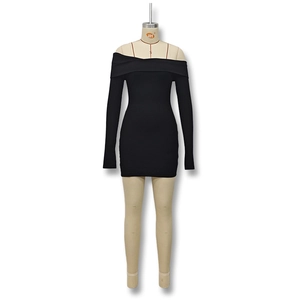 Close-up of ribbed knit texture on a black off-shoulder long sleeve bodycon dress