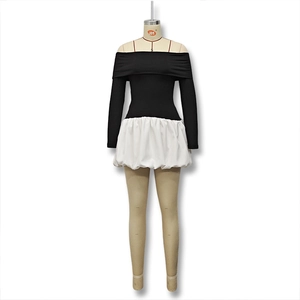 Detailed view of the off-shoulder black bodice and white puff skirt stitching contrast
