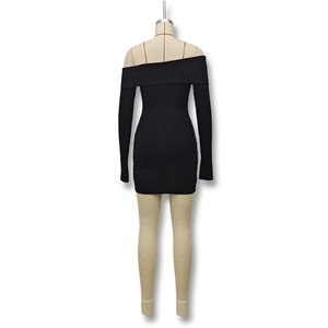 Close-up of the ribbed knit fabric and off-the-shoulder neckline on black mini dress
