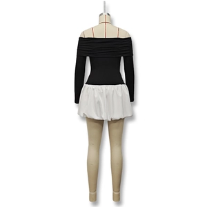 Detailed view of off-shoulder puff dress with black bodice and white balloon skirt