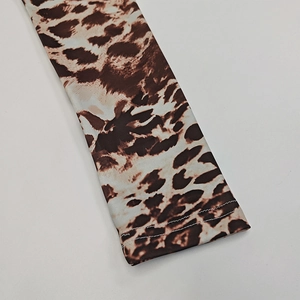 Detailed close-up of leopard print sleeve cuffs with professional flat stitching