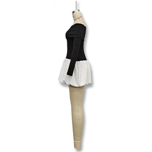 Side profile of off-shoulder long sleeve dress with white puff skirt and black bodice